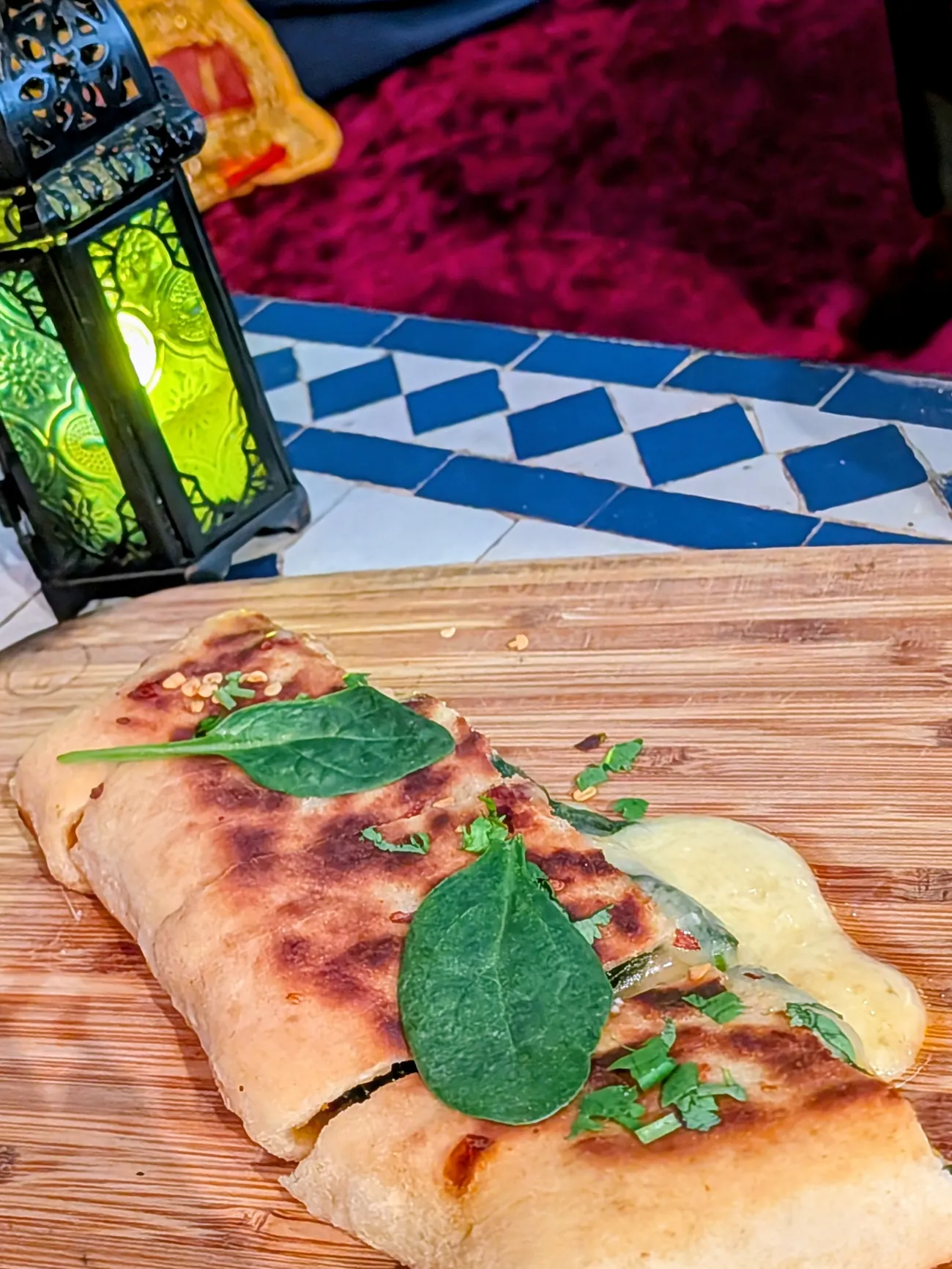 Melwi, pan cooked Moroccan bread with goats' cheese and baby spinach
